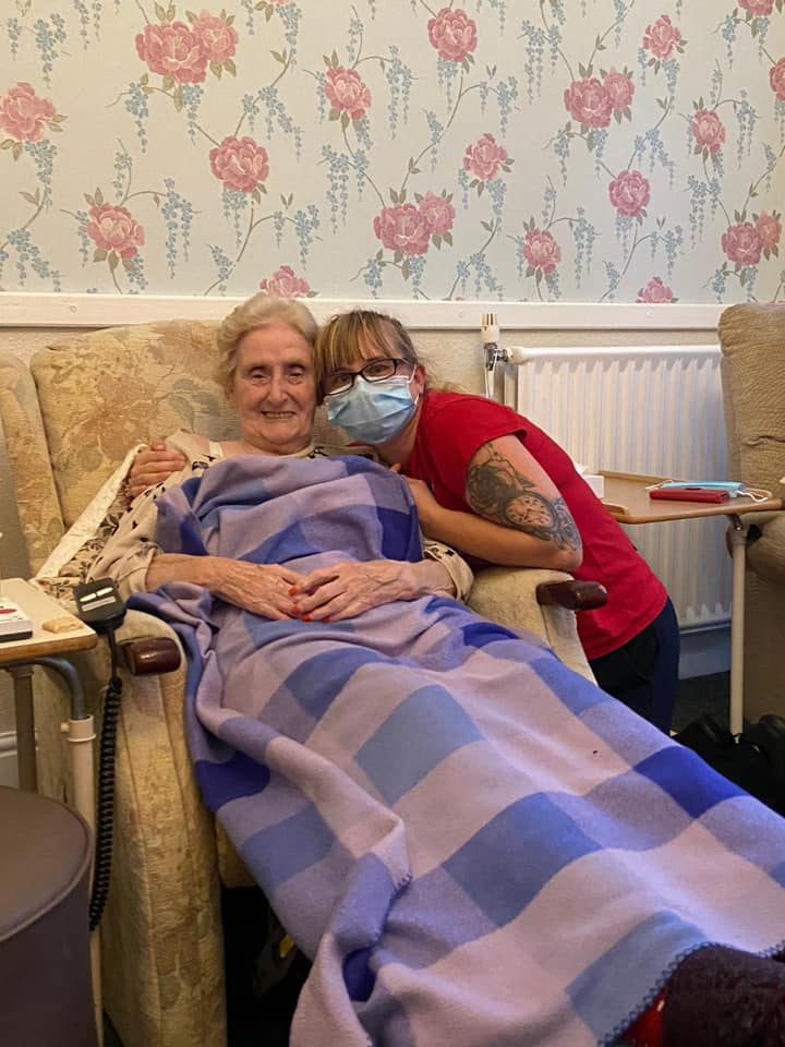 Resident and staff member enjoying a moment together