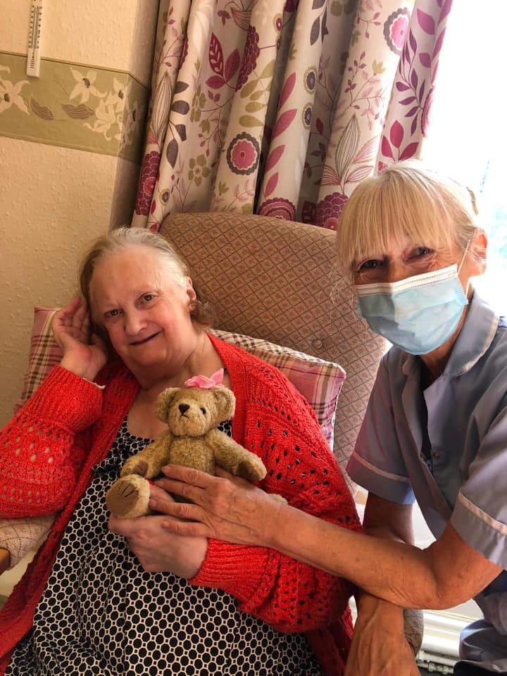 Resident and staff member share a moment.