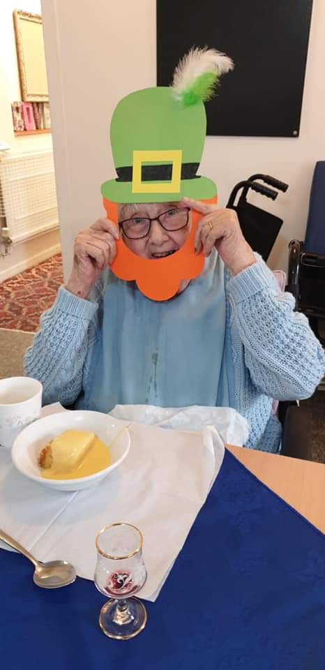 Resident celebrating with a playful hat accessory.