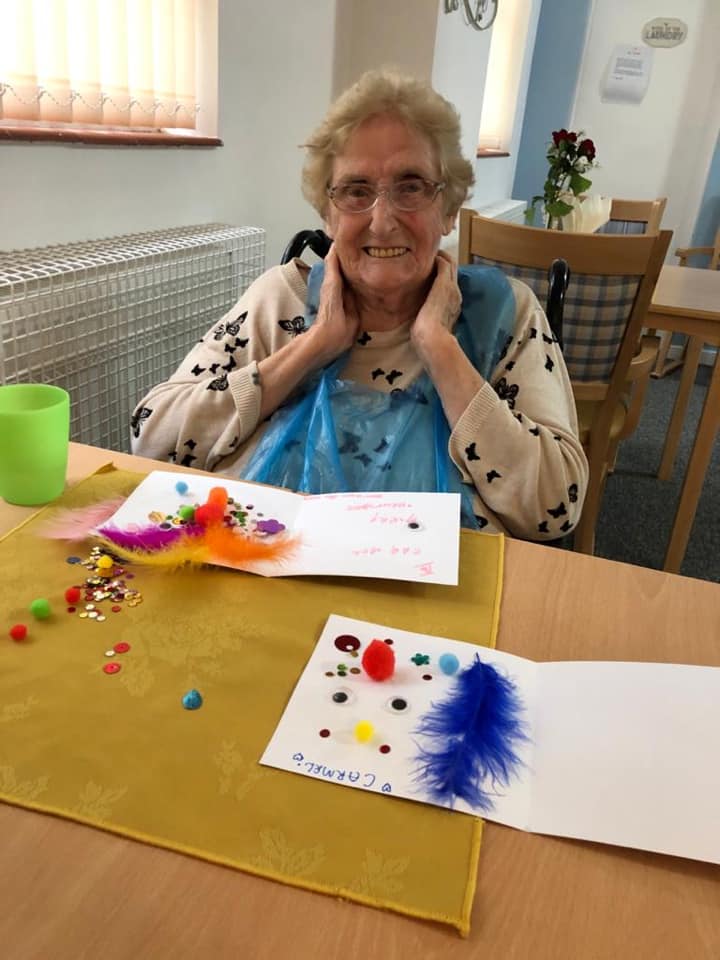 Resident engaged in an arts and crafts activity.