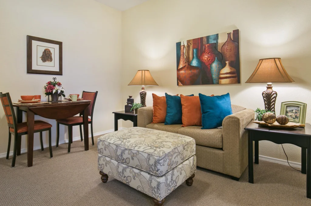 Cozy living area with decorative accents and dining table.