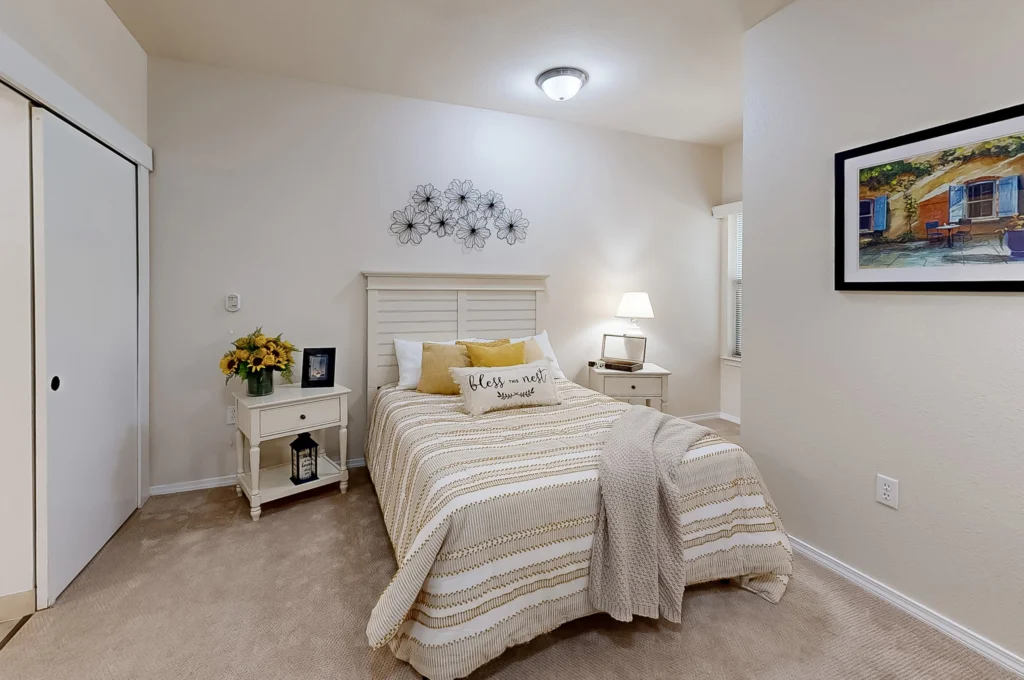 Cozy resident bedroom with decorative touches.