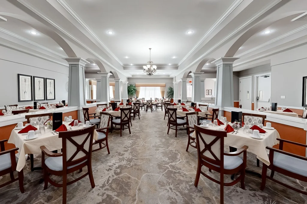 Elegant dining room setup with tables and chairs.