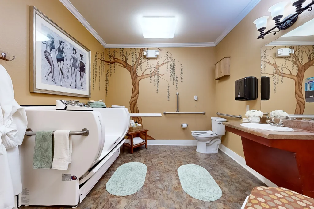 Spacious bathroom with accessible features and decor