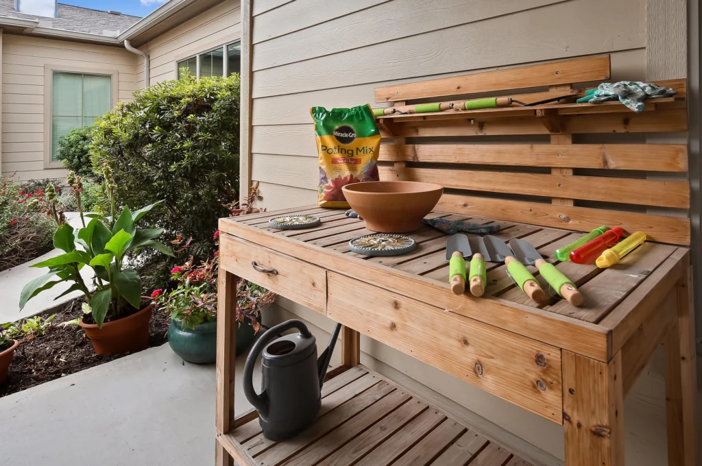 Gardening station with tools and pots in an outdoor area.