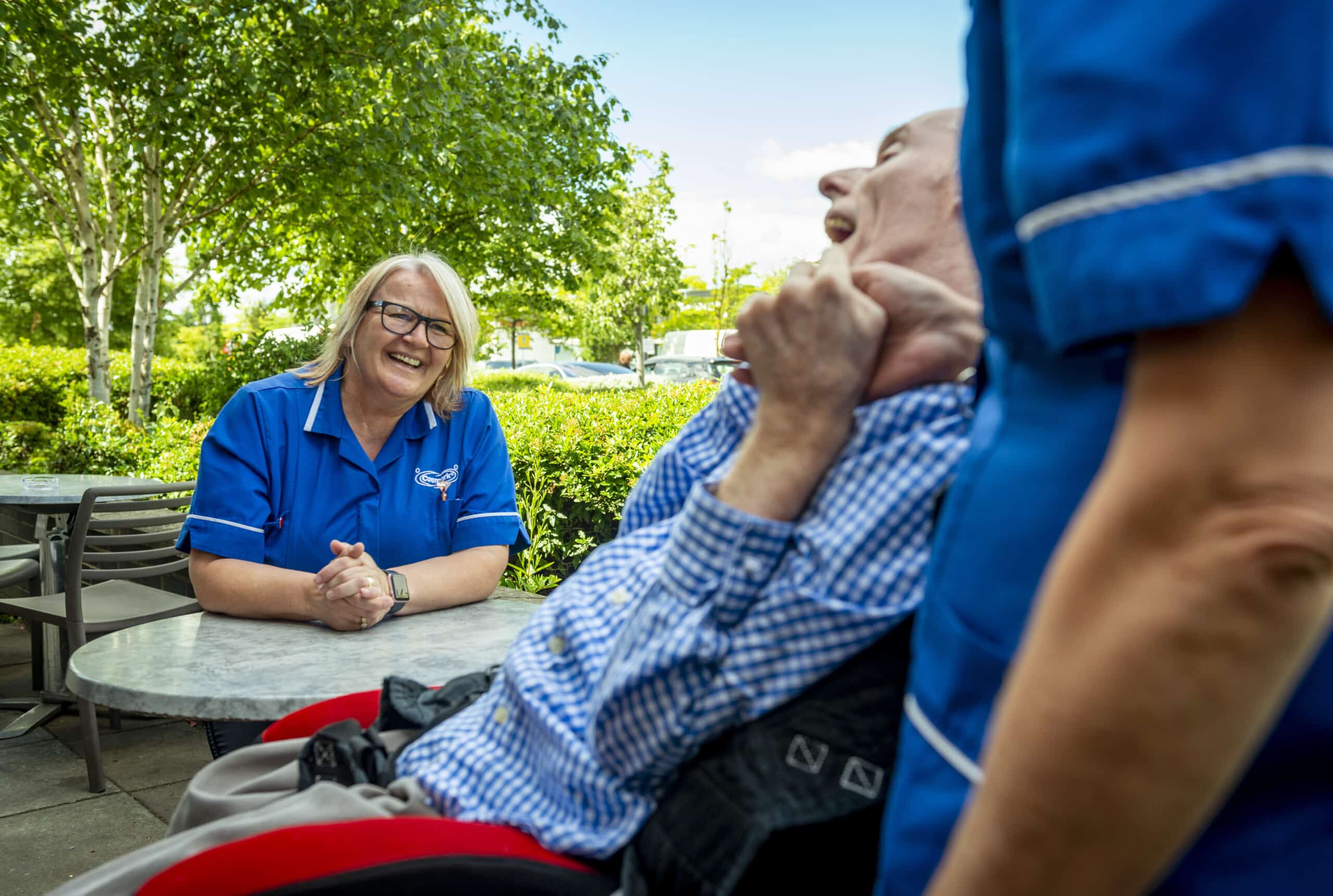 Staff and resident enjoying time outdoors.