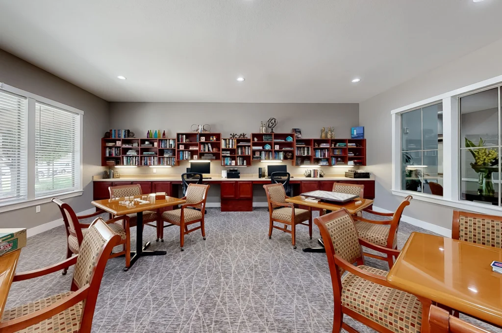 Cozy common area with bookshelves and tables