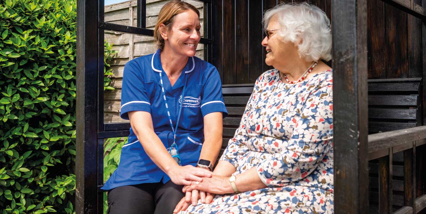 Staff member engaging with a resident outdoors