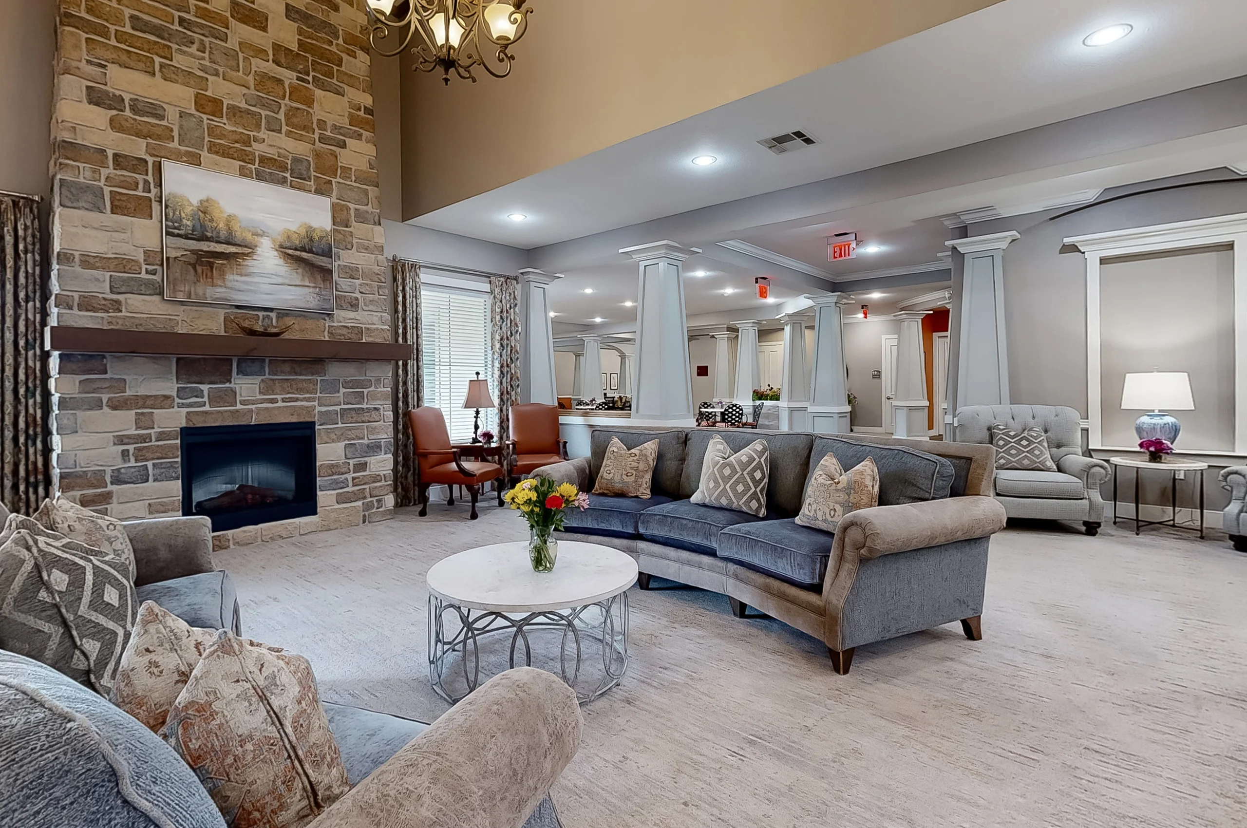 Cozy common area with comfortable seating and a fireplace.