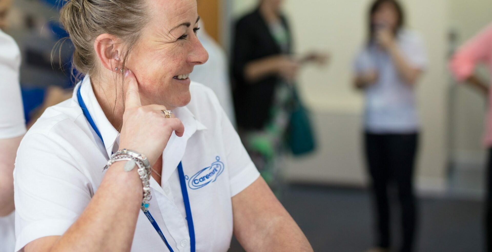 Smiling staff member interacting with residents