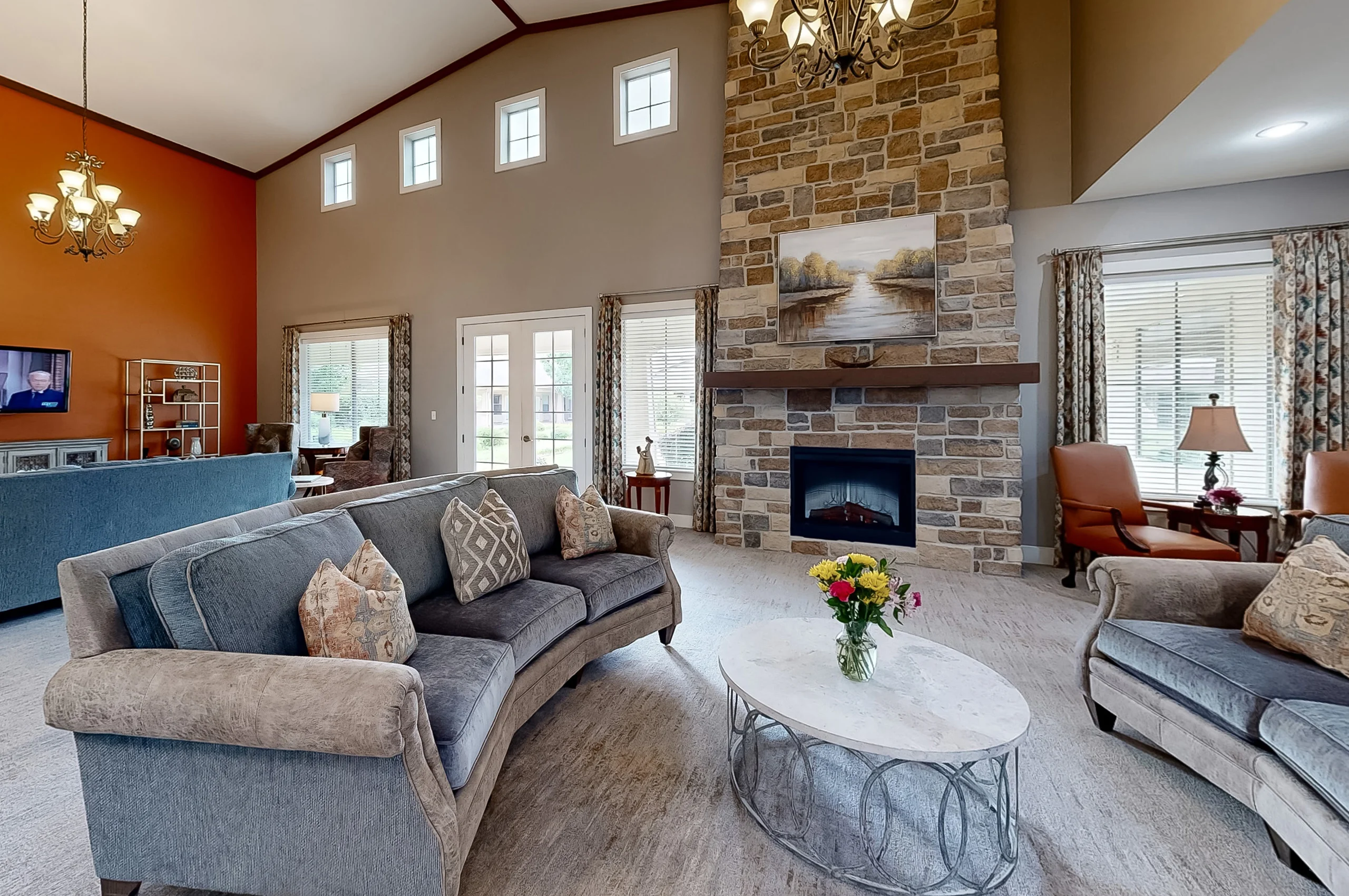Cozy living room with seating and a fireplace