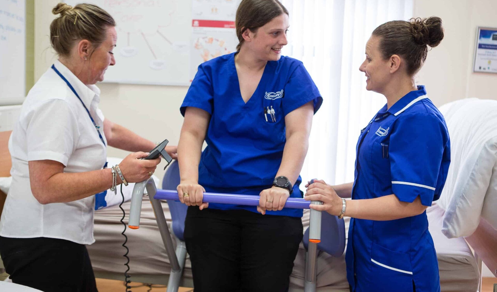 Staff assisting each other in a care setting