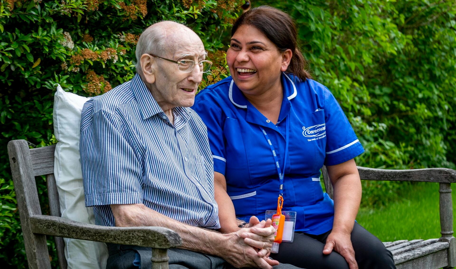 Resident enjoying time outdoors with staff member.