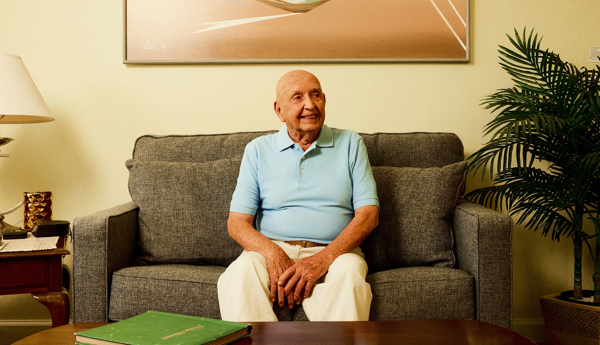 Senior man sitting comfortably on a couch