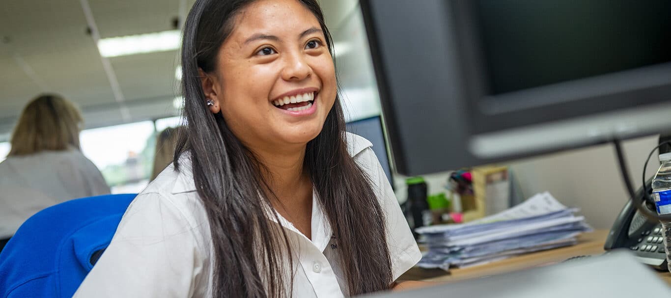 Smiling staff member in an office setting