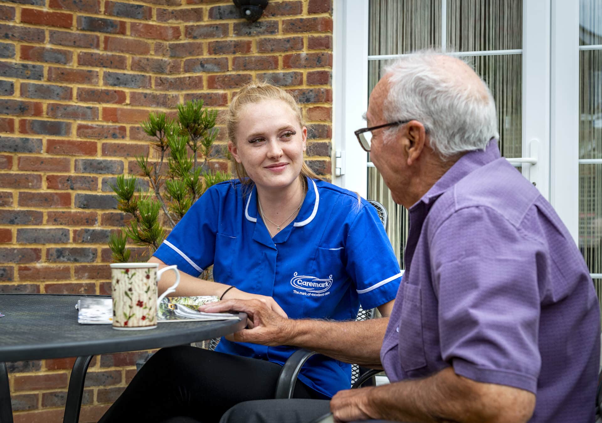 Staff member engaging with resident outdoors