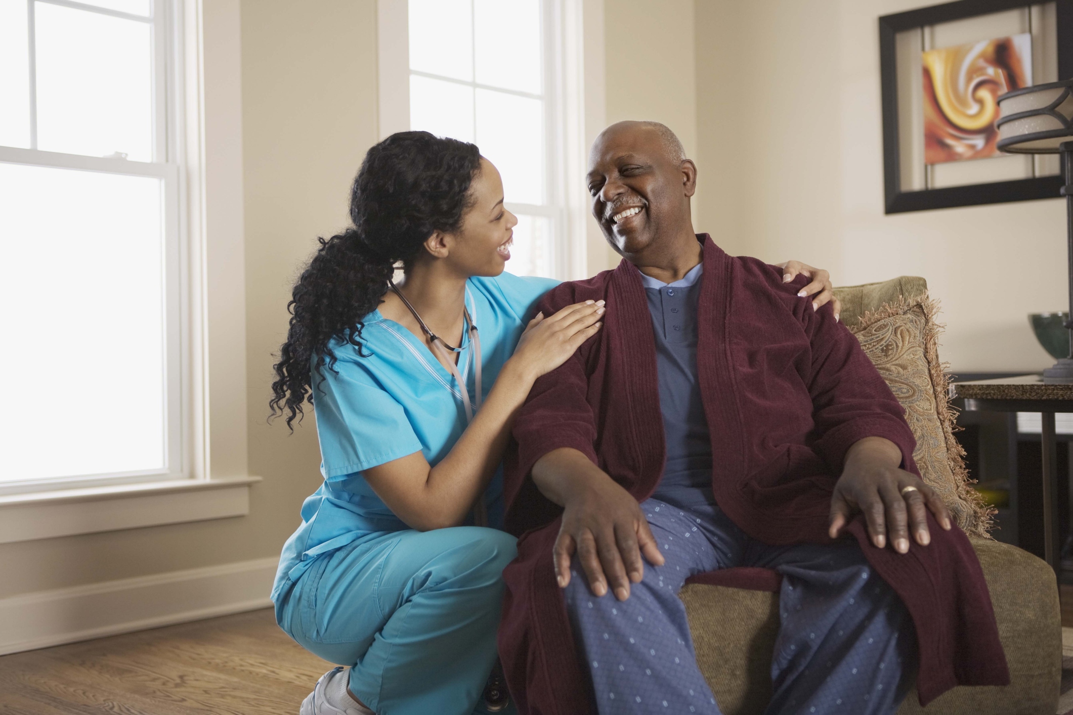 Caregiver interacting with a senior resident.