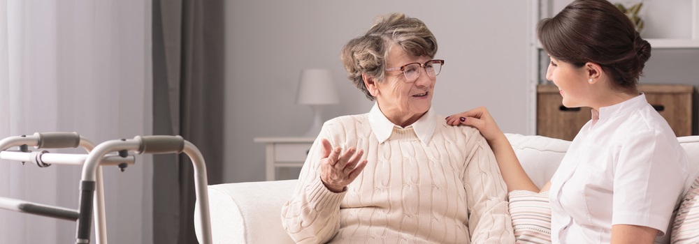 Caregiver engaging with senior resident