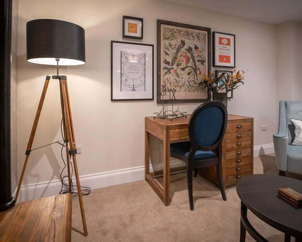 Cozy interior space with desk and decorative elements.