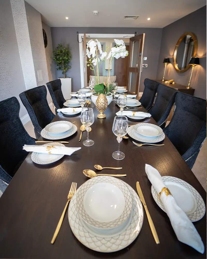 Elegant dining table set for a meal.
