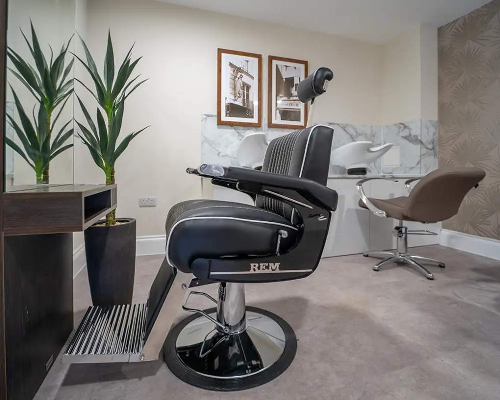 Hair salon chair and styling area.
