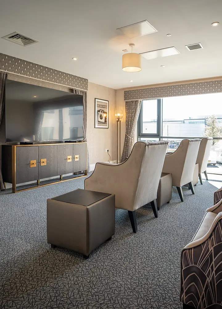 Common area with seating and TV