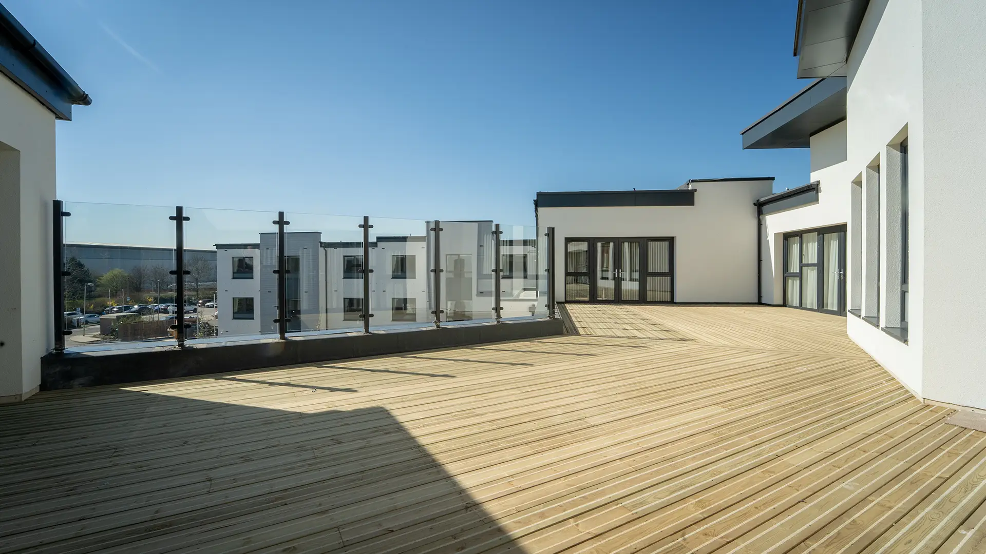 Large outdoor terrace with wooden flooring