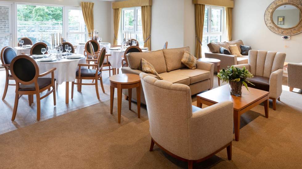 Cozy common area with seating and dining setup.