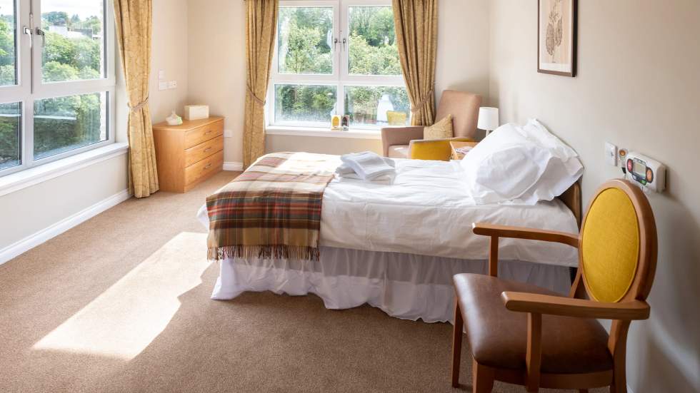 Comfortable bedroom with natural light and view