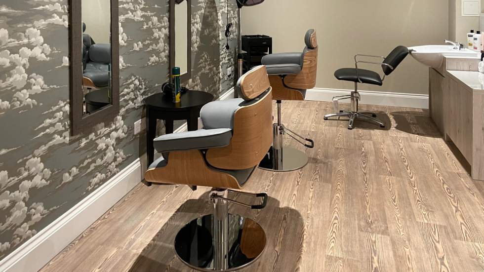 Hair salon area with modern styling chairs