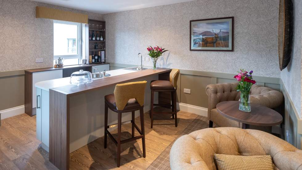 Modern kitchen area with flowers and decor