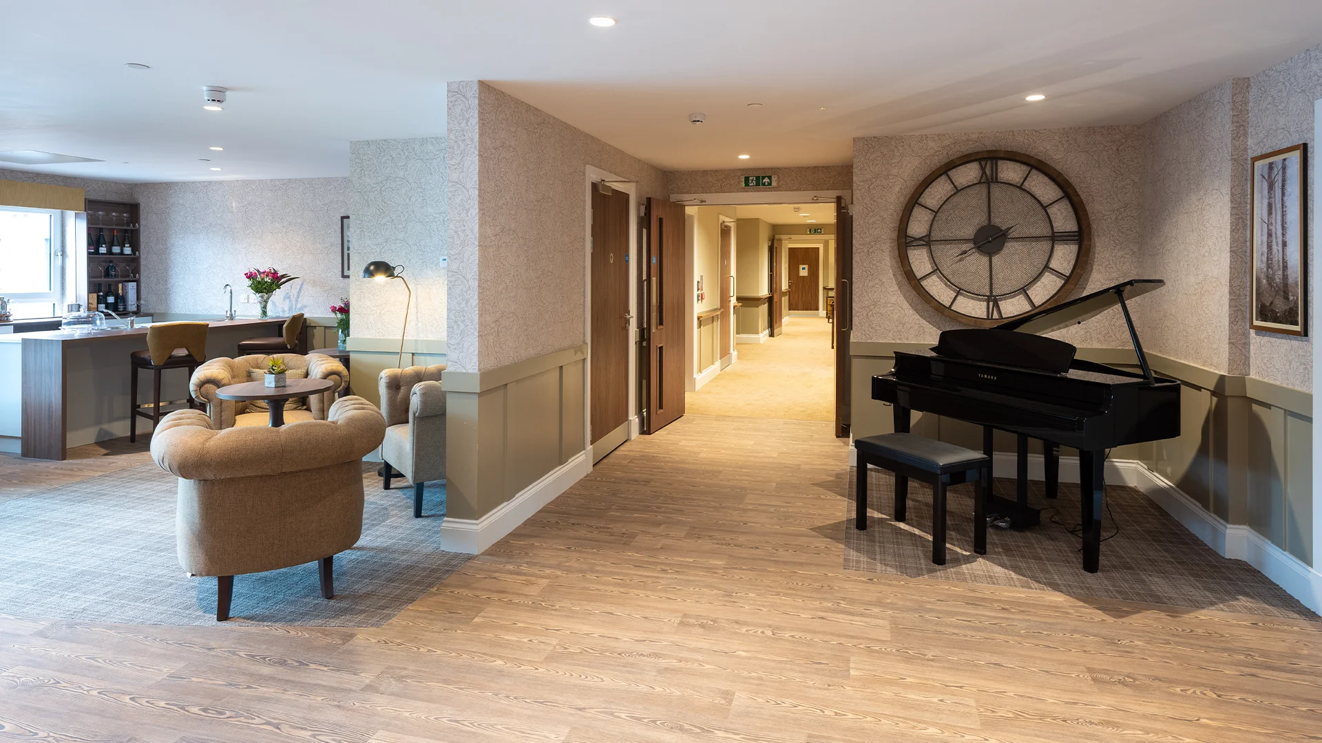 Common area with a piano and seating.
