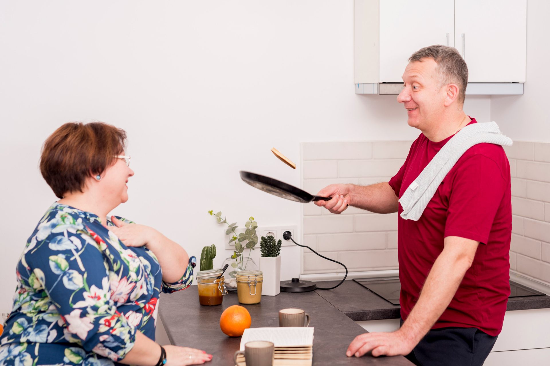 Residents enjoying cooking together in a kitchen