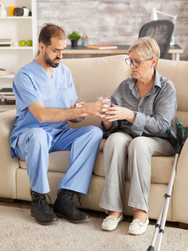 Healthcare worker assisting a senior resident