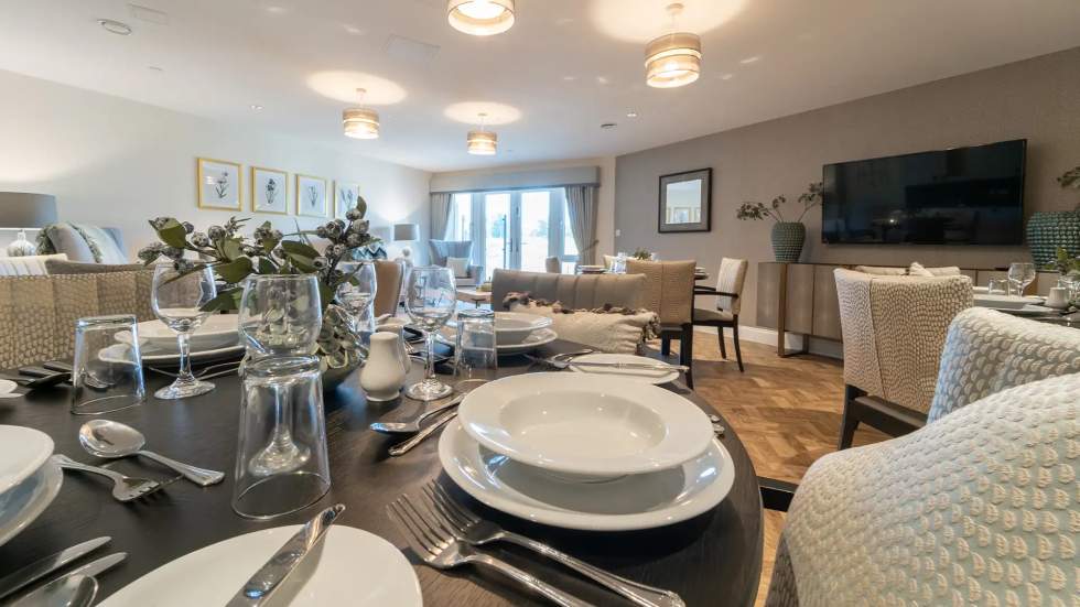 Elegant dining area set for a meal.