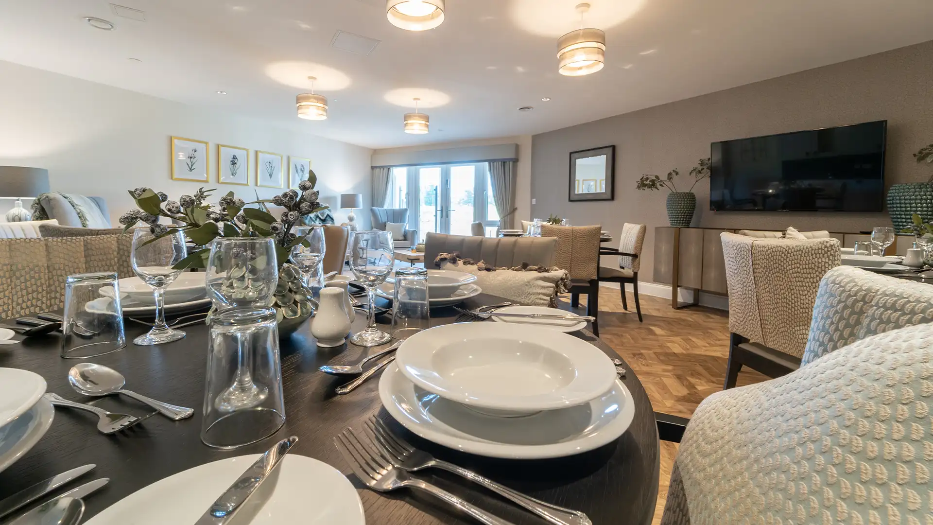 Dining area set for a meal with tableware.