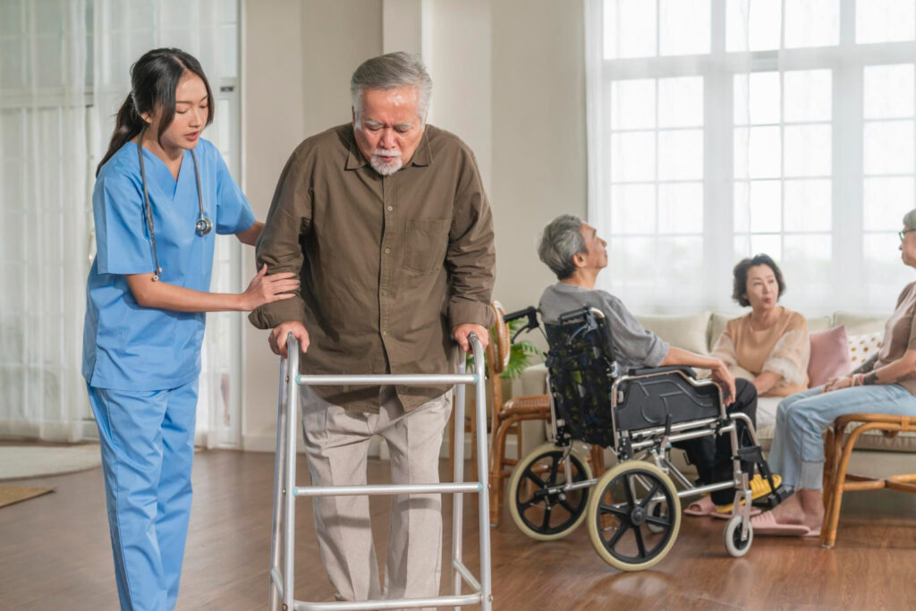 Care staff assisting a resident with mobility.