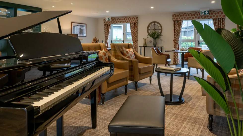 Interior common area with piano and seating