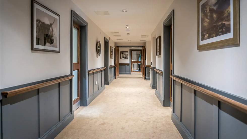 Quiet hallway with framed artwork