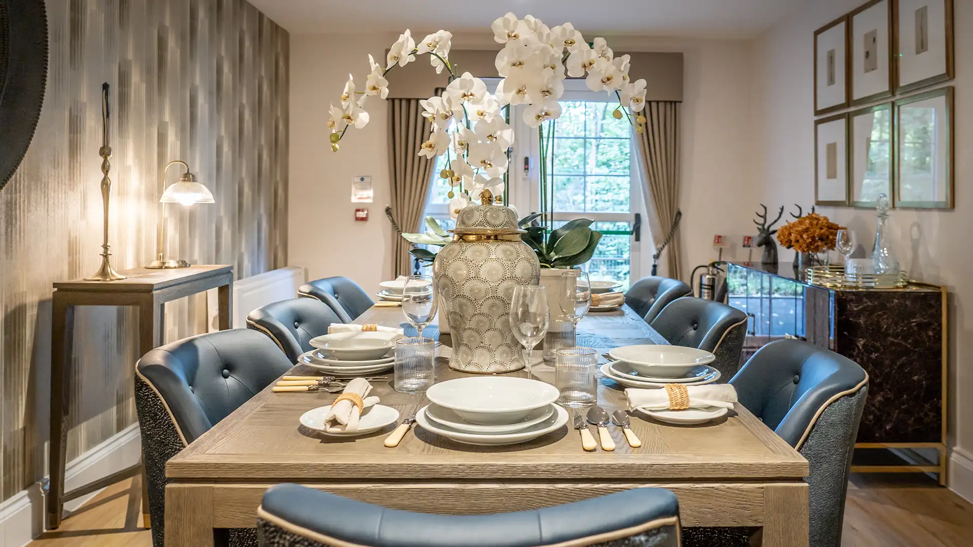 Elegant dining setup with tableware and flowers