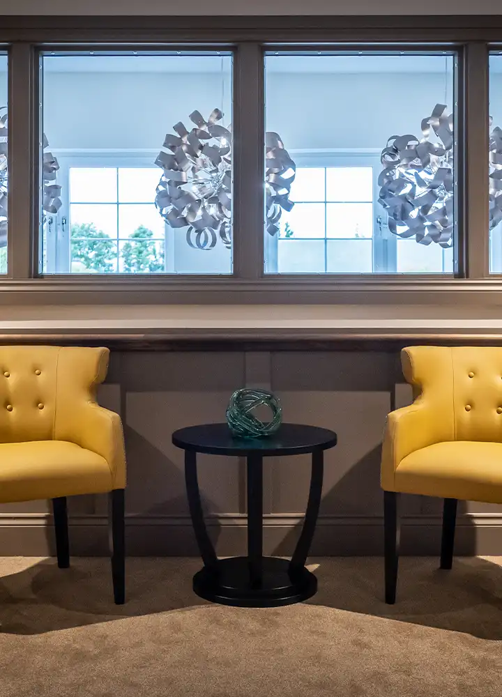 Cozy seating area with yellow chairs and decor