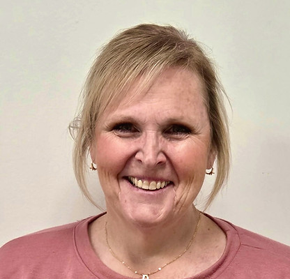 Smiling woman with short hair and earrings