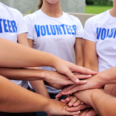Group of volunteers with hands together