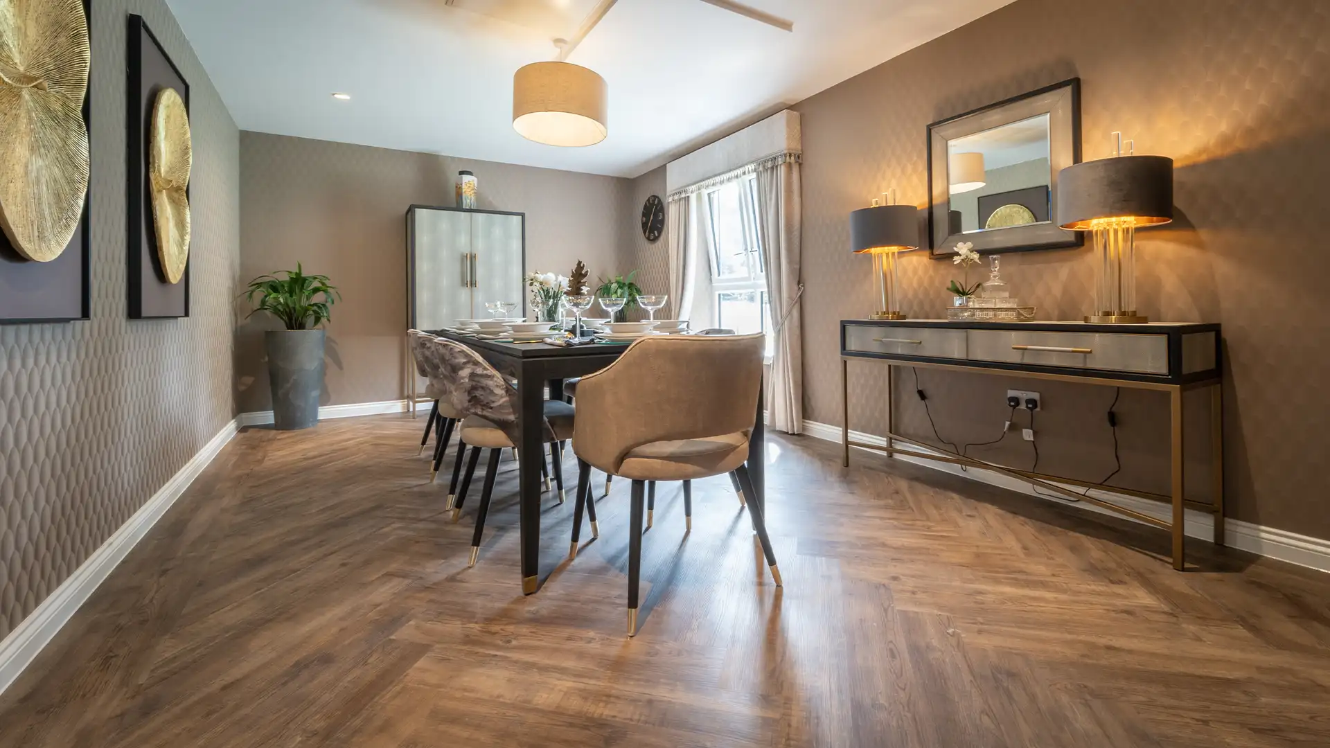 Elegant dining room setup with table and chairs.