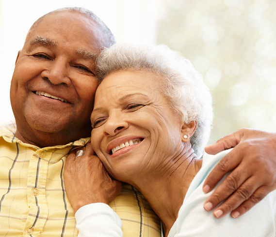 A happy elderly couple smiling together.