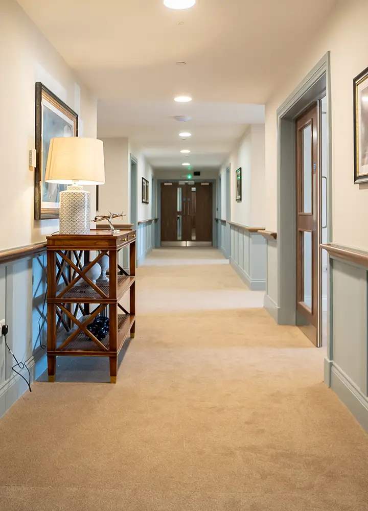 Well-lit hallway in a senior care facility