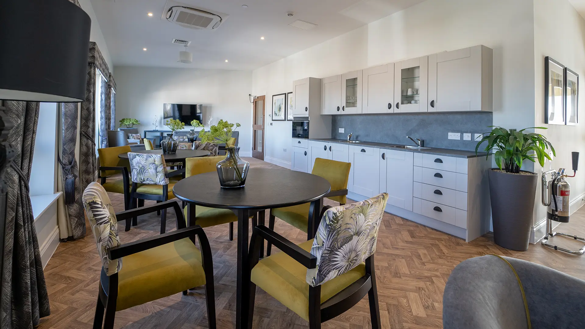 Bright common area with kitchen and seating