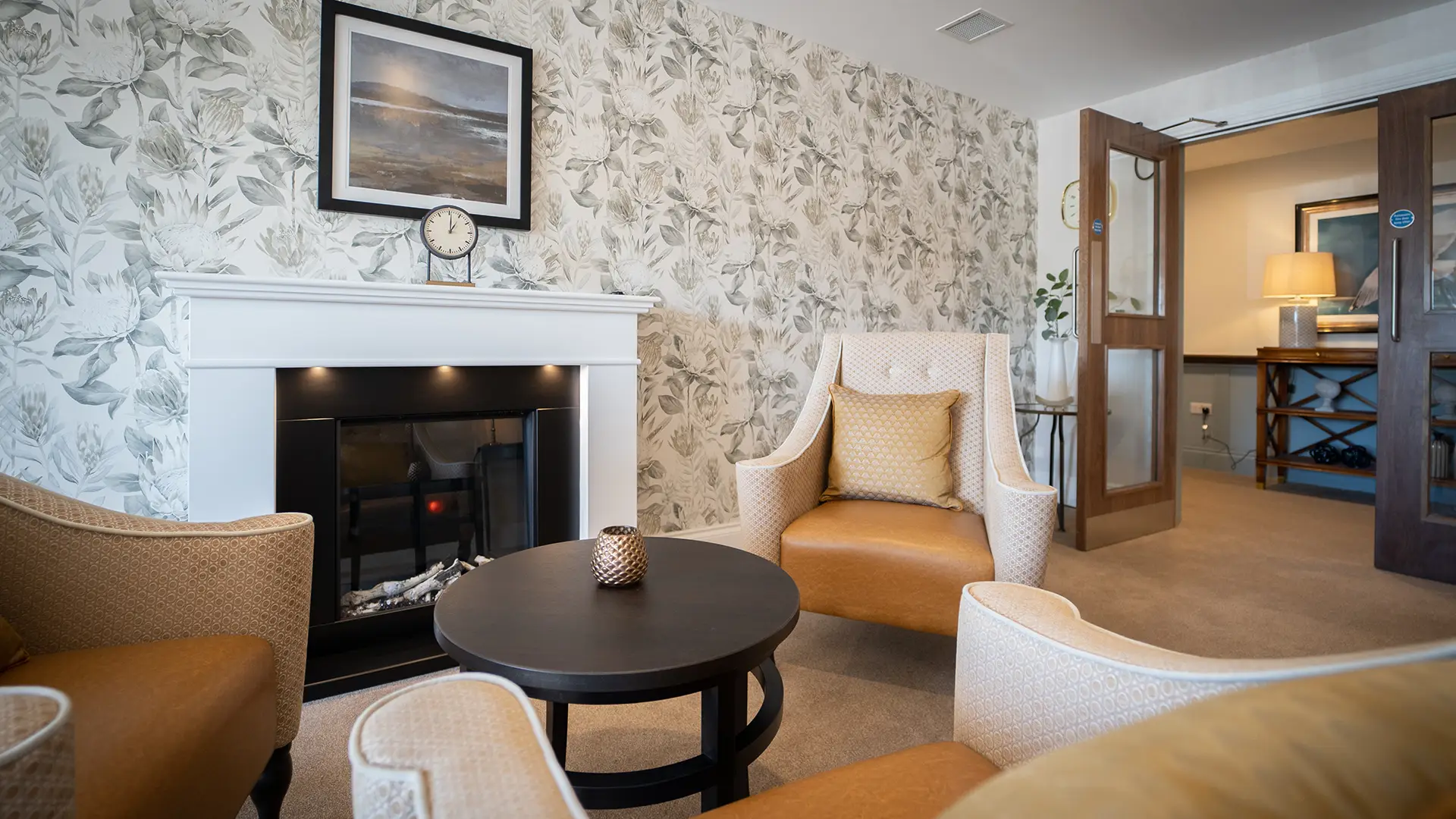 Relaxing common area with seating and a fireplace