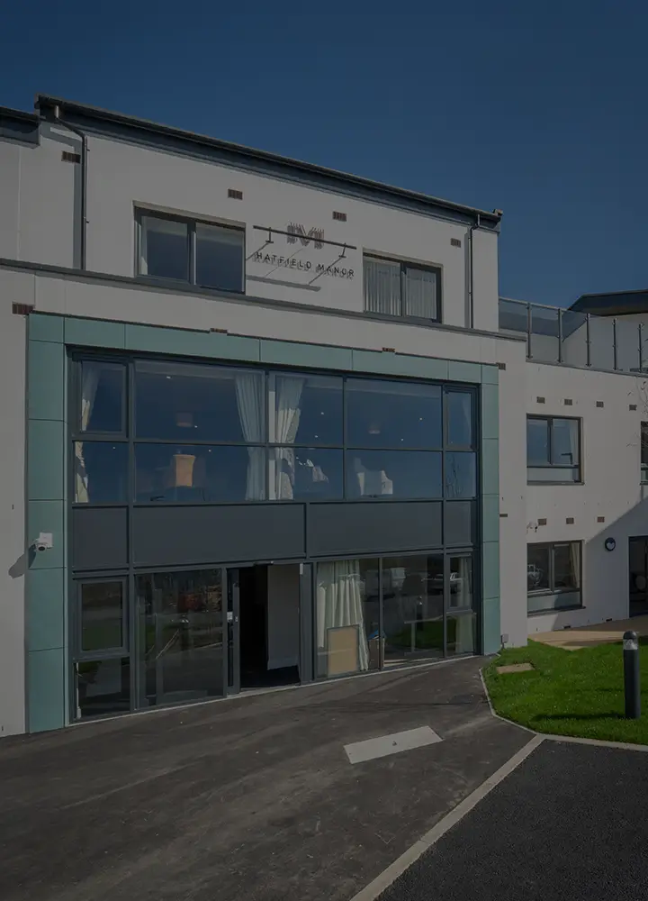 Exterior view of Escan Manor facility