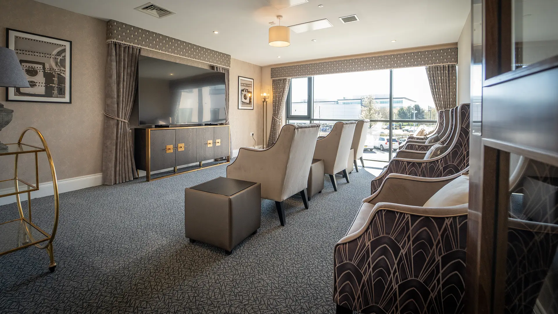 Elegant common area with seating and TV.